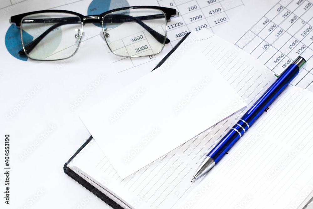 Notepad with pencil and office tools. BUSINESS and finance concept. Notepad with pencil and office tools. BUSINESS and finance concept.