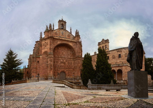 Facade of the Convent of San Esteban and honorary statue to Francisco e Vitoria, from the city of Salamanca, Castilla y León, Spain, photograph taken in winter 2020 (December-January) photo