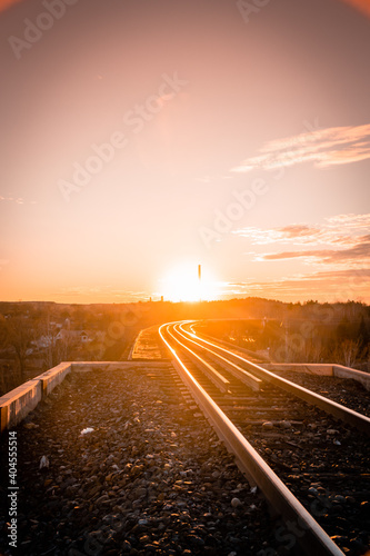sunset over railroad tracks