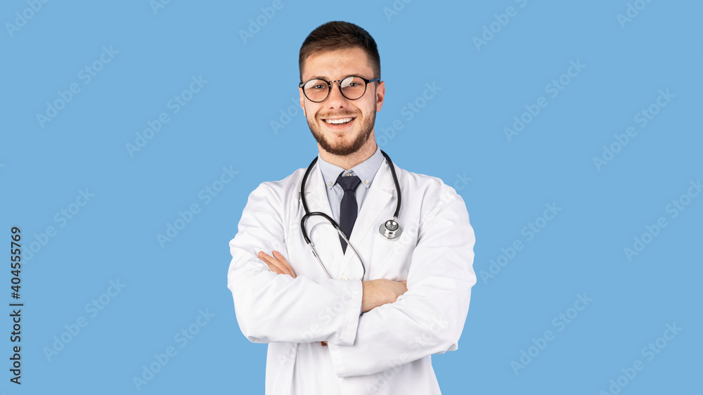Portrait Of Confident Male Doctor Posing Over Blue Background, Panorama Portrait Of Confident Male Doctor Posing Over Blue Background, Panorama