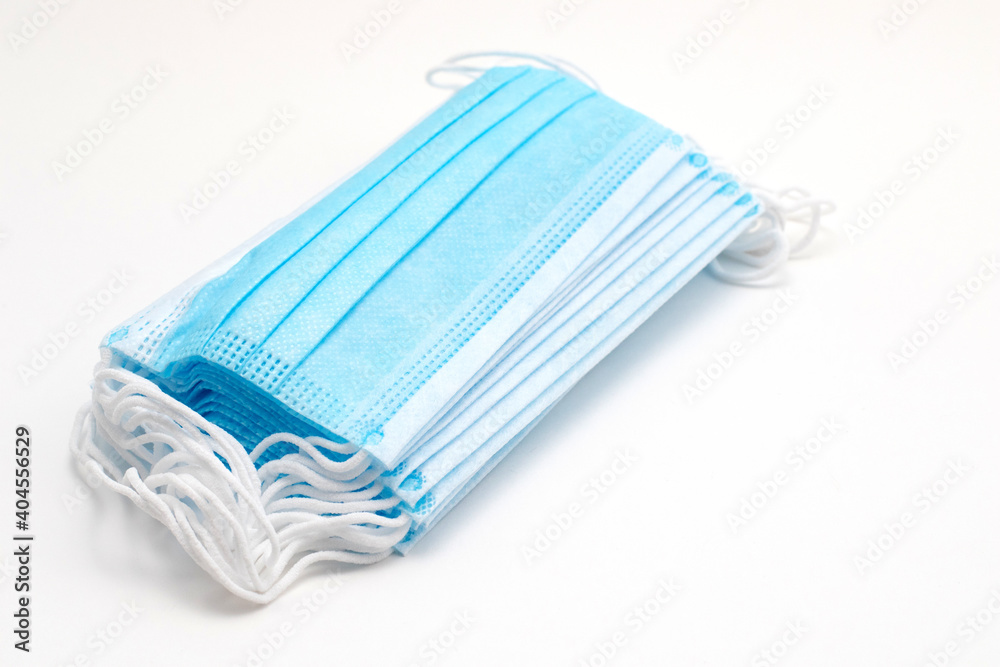 Stack of surgical medical face mask for protection on white background Stack of surgical medical face mask for protection on white background