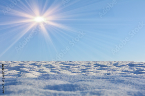 Snow field with many  blue sky and sun © Claudia Evans 