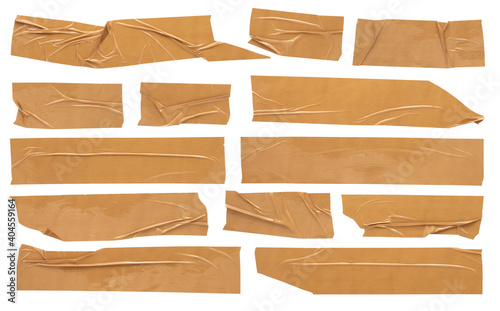 Beige adhesive tape, set of crumpled torn pieces of sticky brown tape on white background