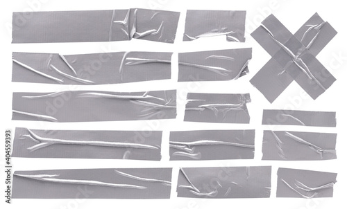 Metallic aluminum reinforced tape, set of silver sticky crumpled torn strips of scotch tape on white background