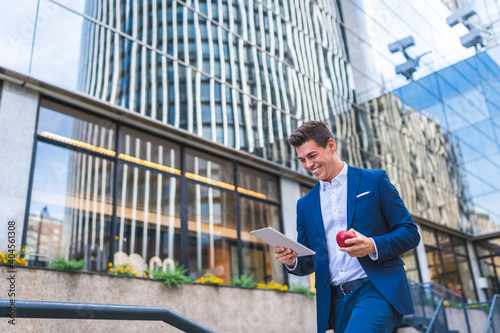 Wallpaper Mural Businessman Using Digital Tablet Outdoors. Torontodigital.ca