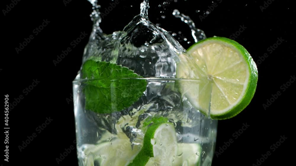 Camera Follows Ice Cube Falling into Mojito Splash. Super Slow Motion at 1000 FPS. Camera Follows Ice Cube Falling into Mojito Splash. Super Slow Motion at 1000 FPS.
