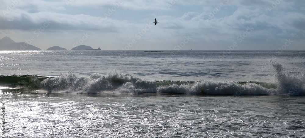 Ocean surf on the beach of Copacabana. Rio de Janeiro, February 2020