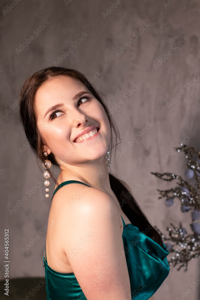 sexy attractive brunette woman in elegant green aquamarine dress in a loft cafe. beautiful sensual girl sexy attractive brunette woman in elegant green aquamarine dress in a loft cafe. beautiful sensual girl