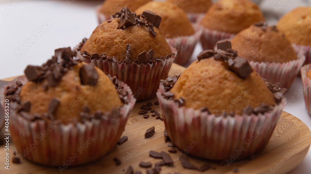 muffins with pieces of chocolate in close-up muffins with pieces of chocolate in close-up