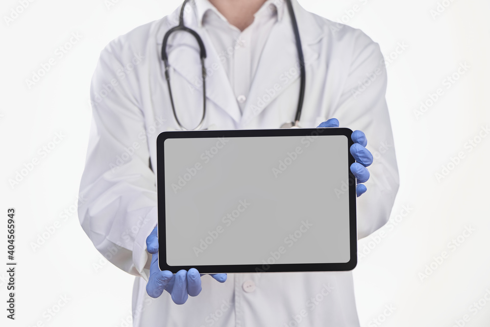 Physician's showing an app on a tablet screen Physician's showing an app on a tablet screen