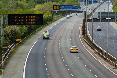 A police car responding to an emergency on the M60 motorway in UK photo