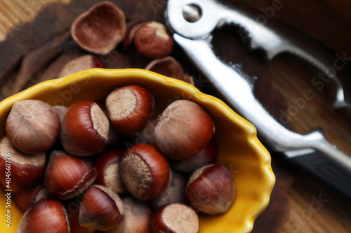Hazelnuts, filbert in burlap sack on wooden backdrop. heap or stack of hazelnuts. Hazelnut background, healty food
