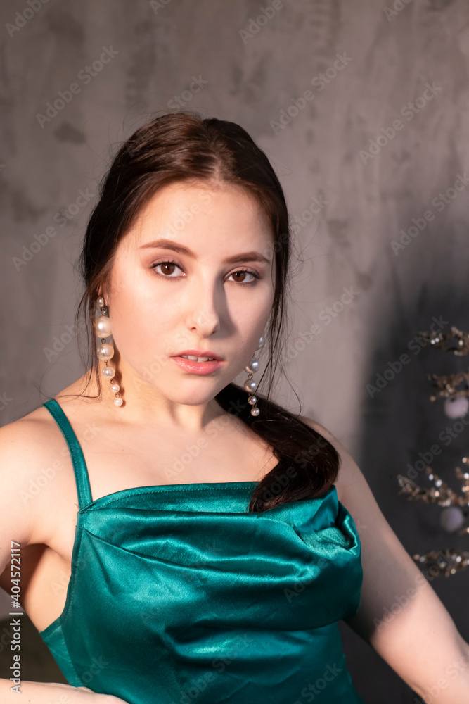 sexy attractive brunette woman in elegant green aquamarine dress in a loft cafe. beautiful sensual girl sexy attractive brunette woman in elegant green aquamarine dress in a loft cafe. beautiful sensual girl