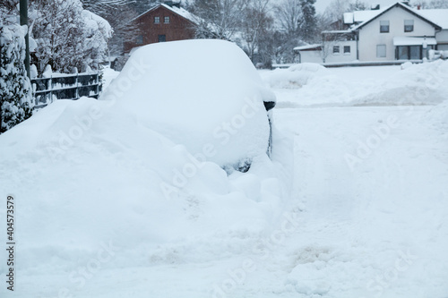 snowbound car beside the street, winter in germany photo