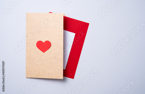 craft letter postcard with a red heart on a gray background. Concept of Valentine's day, mother's day, wedding day