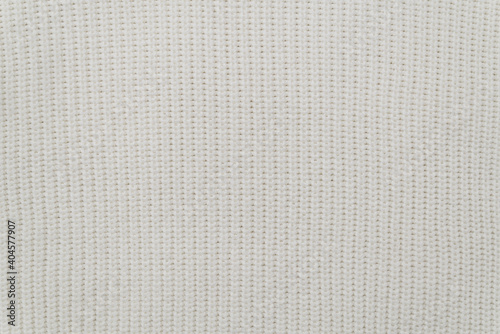 the background of a white knit fabric copy space. soft knitwear structure