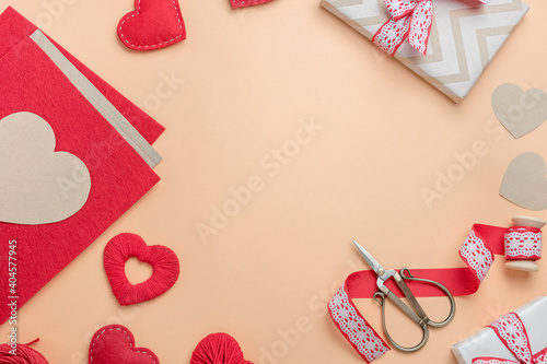 Workplace for making handmade decorations for Valentine's Day. Top view with free space for text.