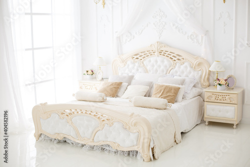 Elegant luxury bedroom. White interior