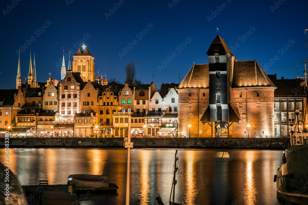 Fototapeta premium Historic old town and historic port crane in Gdansk in the evening time, Poland