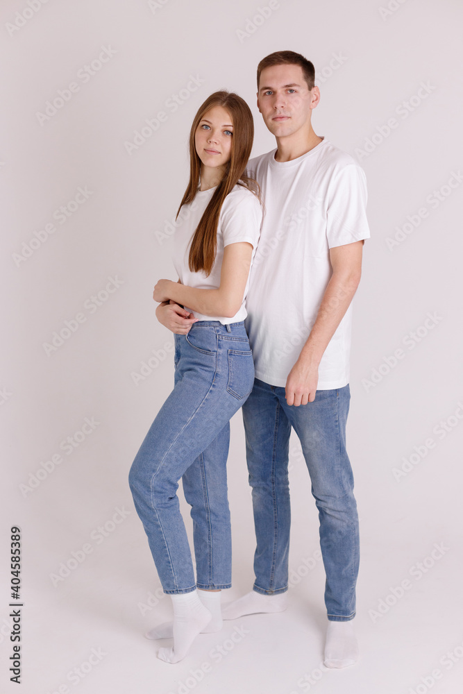 couple in white T-shirts on an isolated background couple in white T-shirts on an isolated background