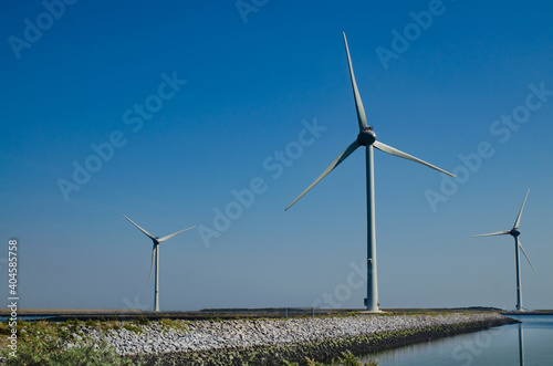 Oosterscheldekering, the netherlands, August 2019. In the Zeeland countryside, wind farms: a particular landscape characterized by wind turbines. © Massimo Parisi