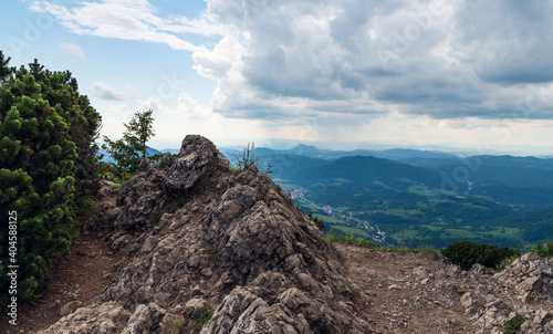 Maly Rozsutec hill summit in Mala Fatra mountains in Slovakia with Terchova village and hills on the background photo