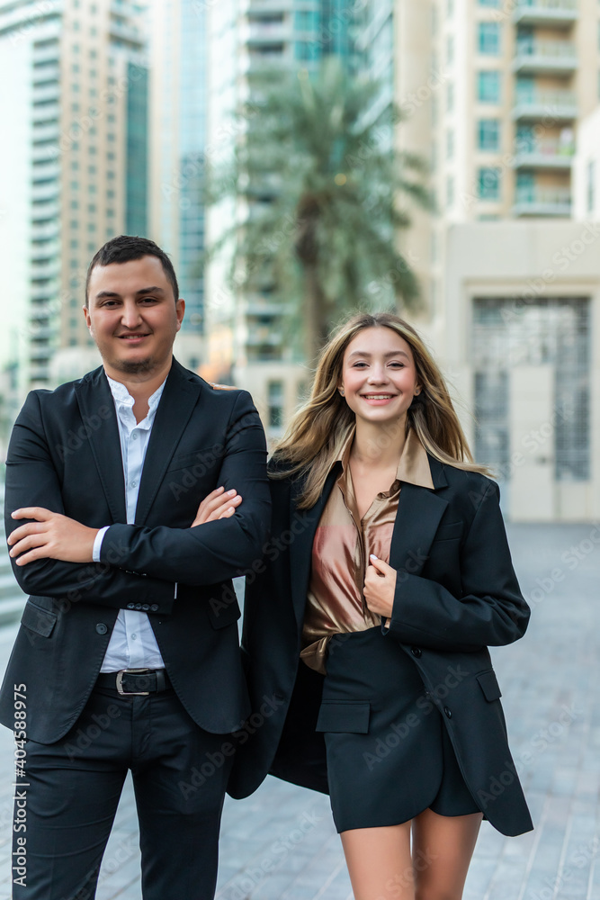 Successful business team standing outside office building Successful business team standing outside office building