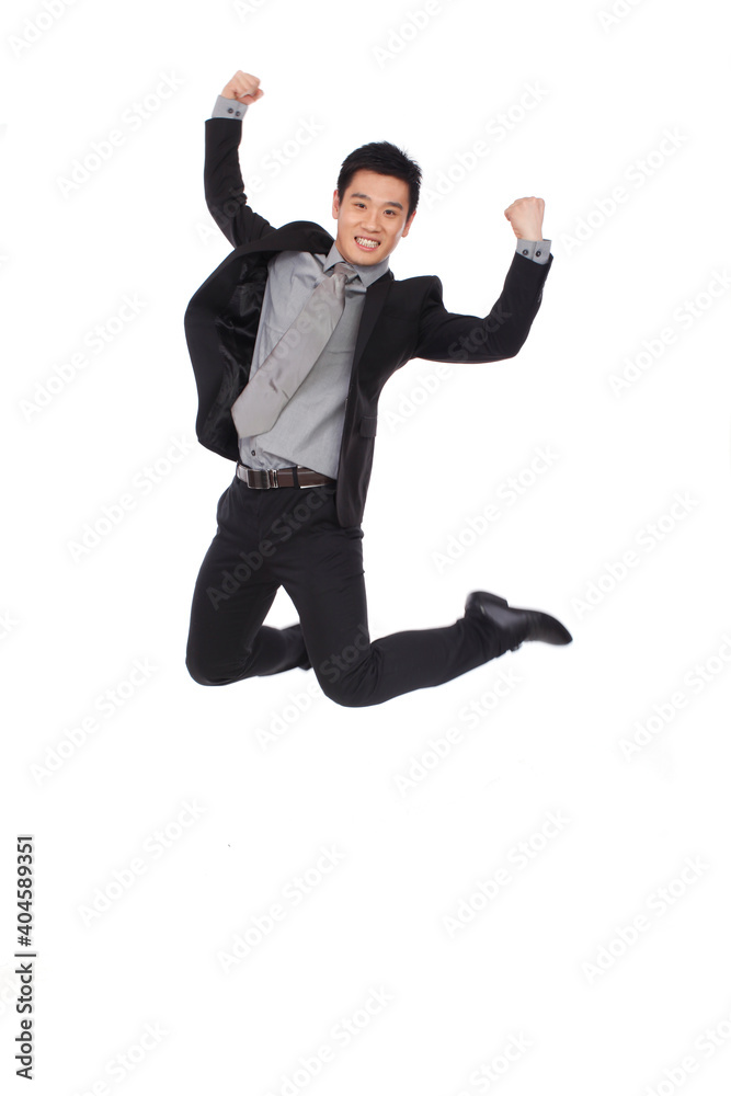 A happy young Business man Jumping up
