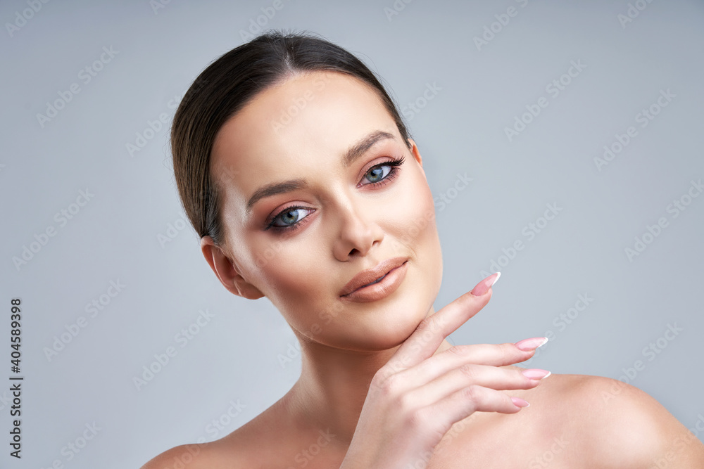 Beautiful face of young adult woman with clean fresh skin Beautiful face of young adult woman with clean fresh skin