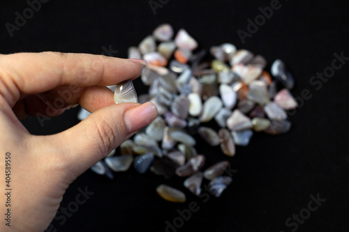 Natural Agate in hand, various types and color, gems mineral collection as nice natural background