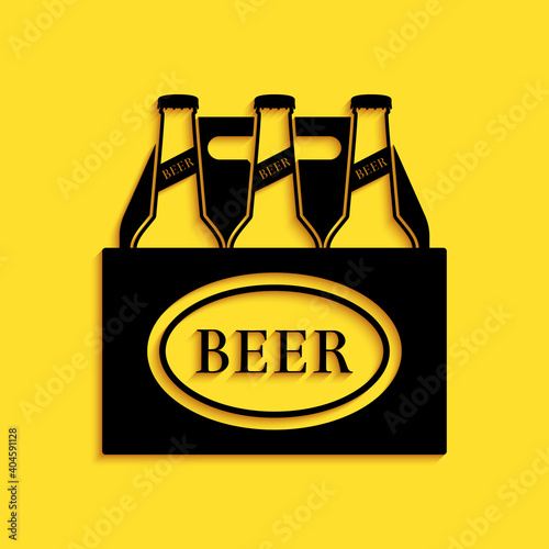 Black Pack of beer bottles icon isolated on yellow background. Case crate beer box sign. Long shadow style. Vector.