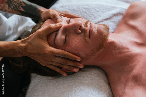 Man Receiving Relaxing Face Massage
