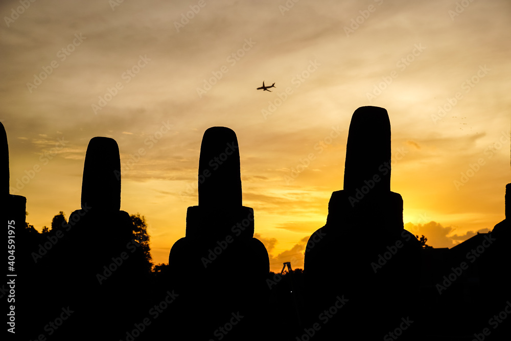 Silhouettes of Prambanan temple at sunset