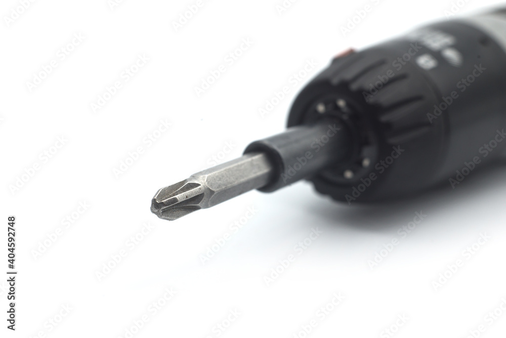 Closeup of screwdriver with an adapter on white background Closeup of screwdriver with an adapter on white background