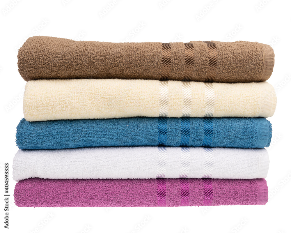 stack of colorful towels isolated on white. stack of colorful towels isolated on white.