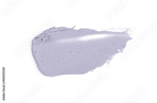 a smear of gray paint or cream is isolated on a white background