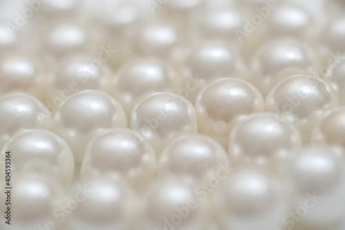 Background from pearls. White round luxury jewel.