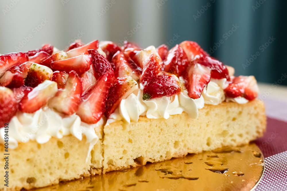 Delicious cutaway pie with cream and fresh strawberry slices. berry pie on the table Delicious cutaway pie with cream and fresh strawberry slices. berry pie on the table