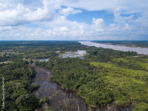 Aerial drone view of Madeira river, igapo igarape lake, Amazon rainforest landscape in Rondonia, Brazil. Concept of ecology, conservation, deforestation, environment, climate change, global warming.
