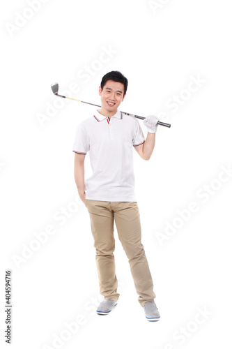A happy young business man playing golf