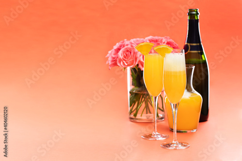 Mimosa cocktail and roses