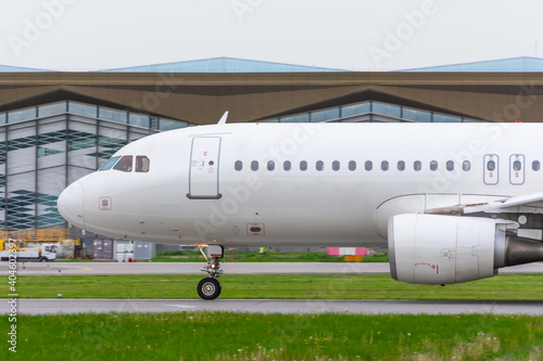 Airplane is taxiing on the runway before departing flight.