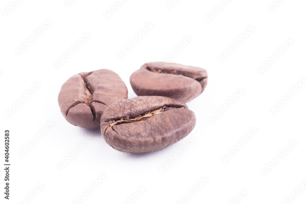 Studio lighting. macro. Coffee grain on a white background. Soft focus. Close-up. Studio lighting. macro. Coffee grain on a white background. Soft focus. Close-up.