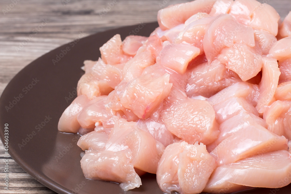 Pieces of fresh raw meat are placed on a plate for cooking. Recipe for cooking meat Pieces of fresh raw meat are placed on a plate for cooking. Recipe for cooking meat