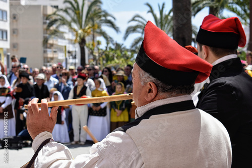 Ibiza Town, Ibiza / Spain - 5 05 19: Selective focus on an man, part of a folklore group, dancing in traditional dress at a celebration of Spanish and Balearic culture