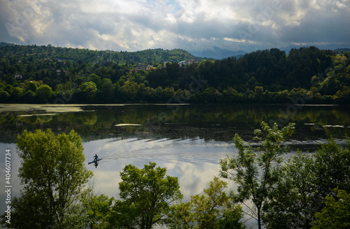 Lake in the mountain surrounded by green forest