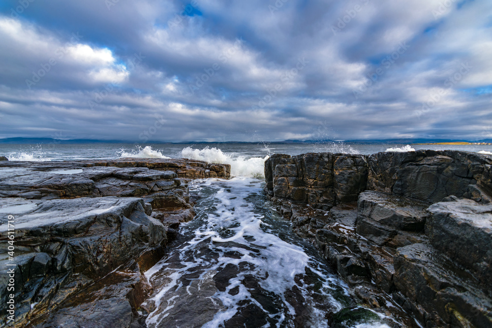 The Atlantic ocean waves crashing in to the cliffs off the west coast of Ireland, County Donegal,  Creavy pier