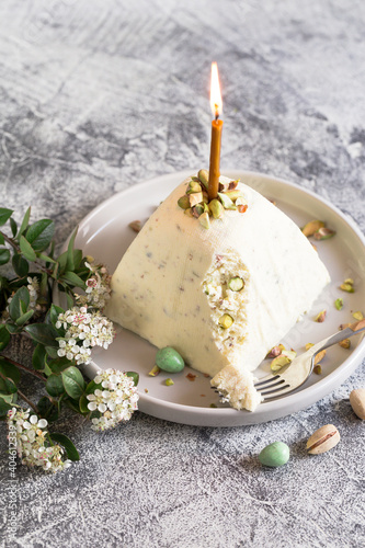 Paskha and kulich with pistachios. Traditional Russian Orthodox Easter Quark Dessert Curd. Easter food background. Traditional cottage cheese cake photo