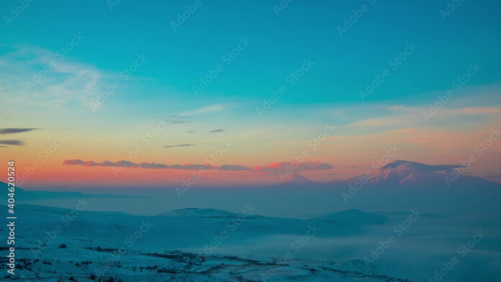 Beautiful sunrise sky above clouds, sunrise clouds in the foggy mountains. Panoramic view on the mountains. Time Lapse clouds on the sunset. Beautiful sunrise sky above clouds, sunrise clouds in the foggy mountains. Panoramic view on the mountains. Time Lapse clouds on the sunset.