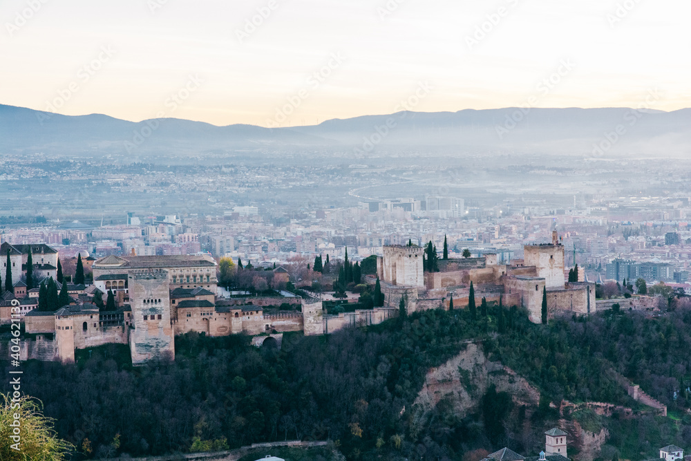 Alhambra palace in Granada at sunset from San Miguel lookout